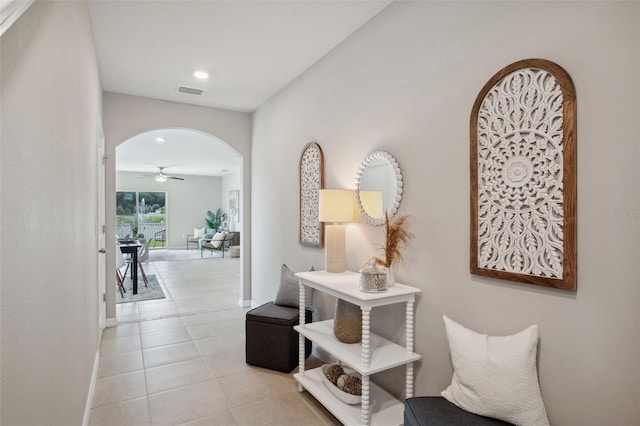 hallway featuring light tile patterned flooring