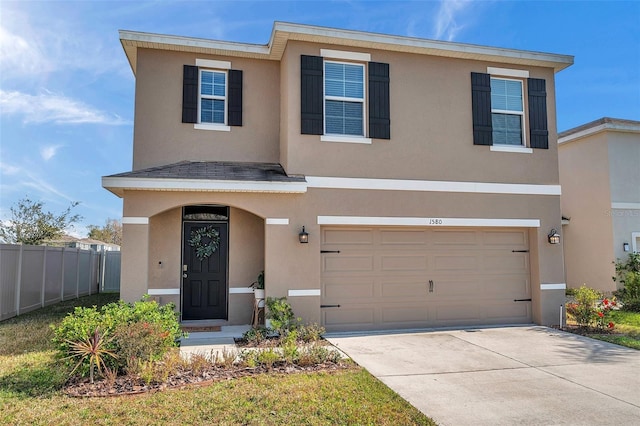 view of front of property with a garage