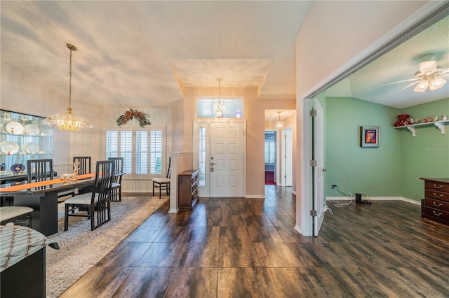 foyer featuring vaulted ceiling and an inviting chandelier