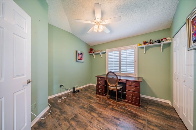 home office featuring ceiling fan, a textured ceiling, dark hardwood / wood-style floors, and vaulted ceiling