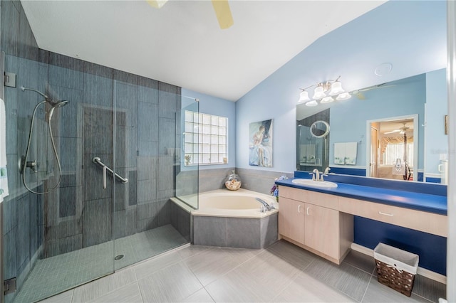 bathroom featuring shower with separate bathtub, tile patterned floors, vanity, ceiling fan, and lofted ceiling