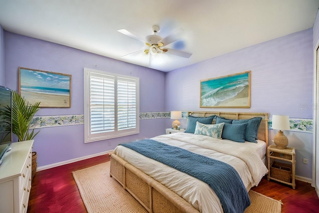 bedroom featuring ceiling fan and dark wood-type flooring