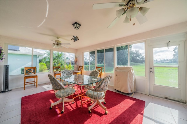 sunroom / solarium featuring ceiling fan and a healthy amount of sunlight