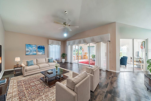 living room featuring ceiling fan and lofted ceiling