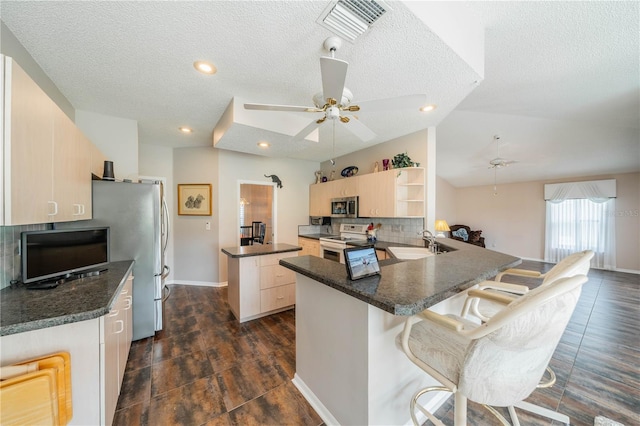 kitchen with white electric range oven, ceiling fan, a textured ceiling, and sink