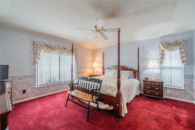 bedroom with ceiling fan, a textured ceiling, and carpet floors