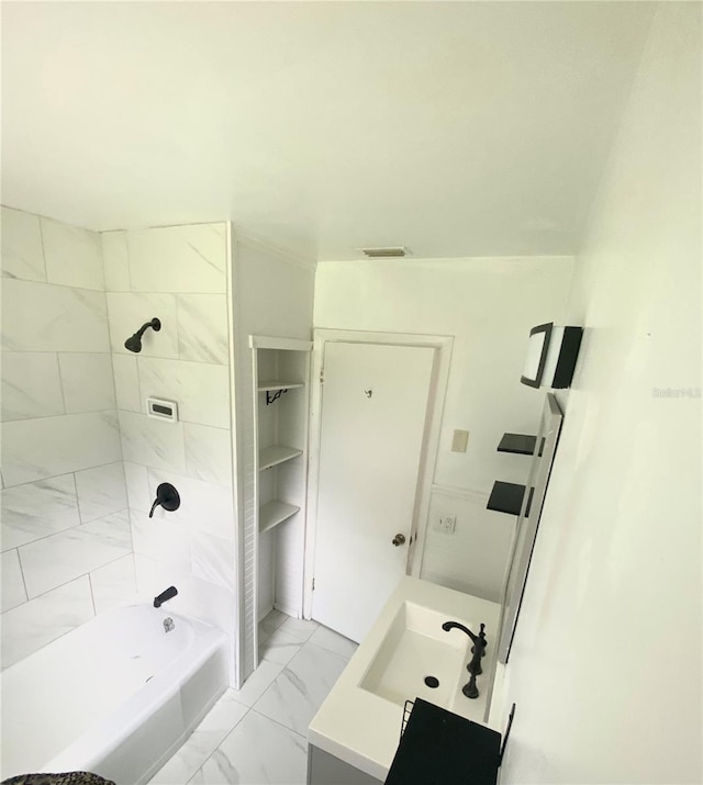 118 5th Jpv St, Winter Haven, FL 33880 - bathroom featuring marble finish floor, shower / tub combination, visible vents, and vanity