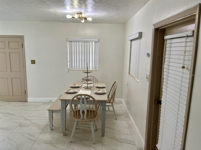 dining room featuring a textured ceiling