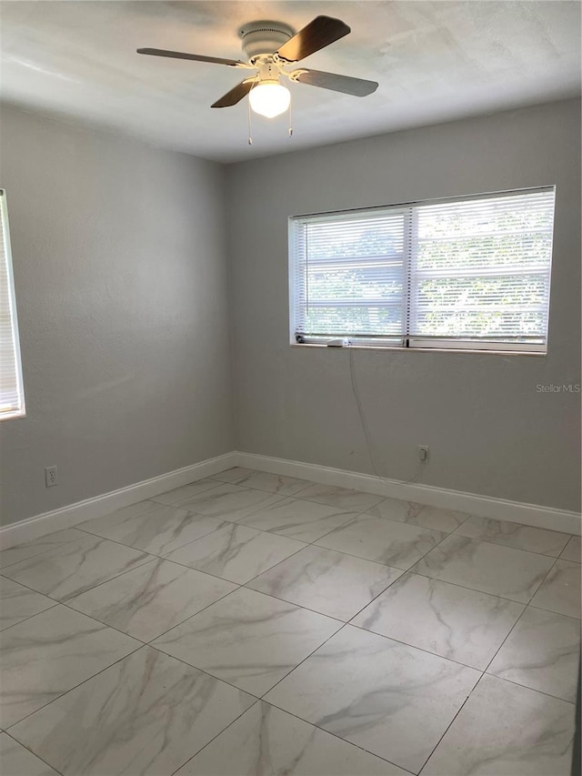 empty room featuring ceiling fan