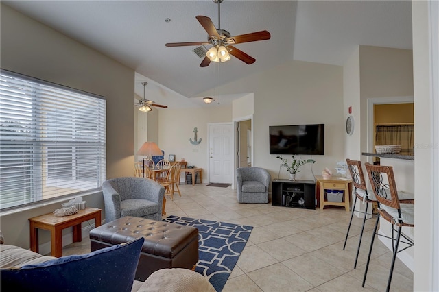 tiled living room with ceiling fan and lofted ceiling