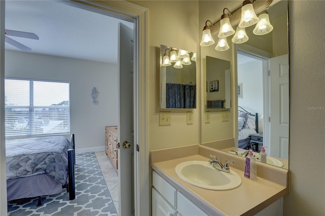 bathroom featuring tile patterned floors, ceiling fan, and vanity