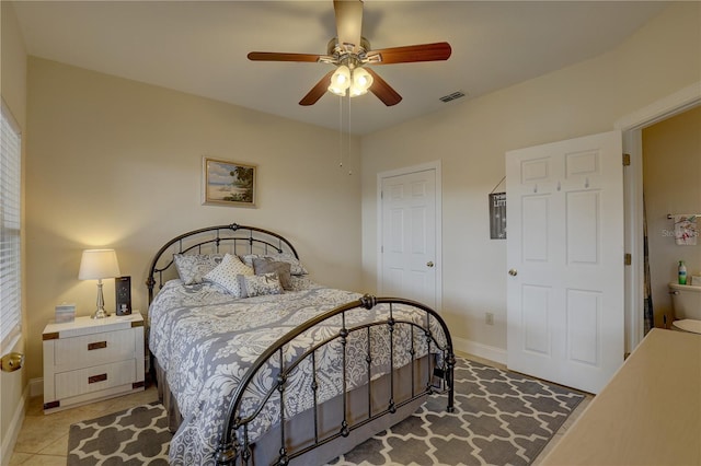 bedroom featuring ceiling fan and light tile patterned flooring