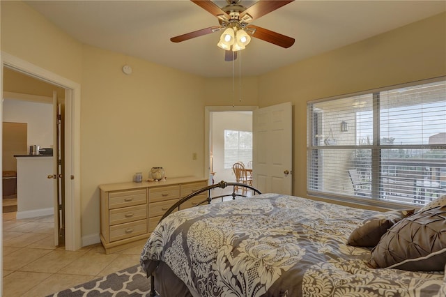 bedroom with ceiling fan and light tile patterned floors