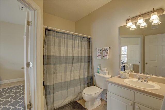 bathroom with a shower with shower curtain, tile patterned floors, vanity, and toilet