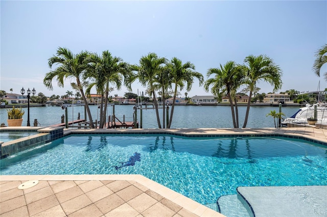 view of pool featuring a boat dock, a water view, and pool water feature