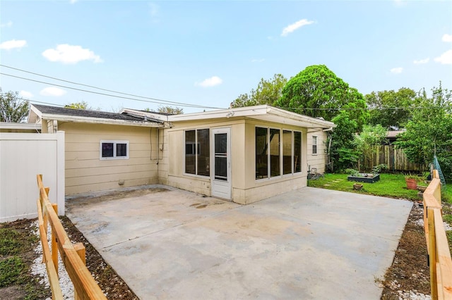 back of house with a patio area