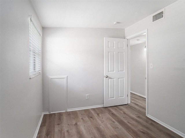 unfurnished room featuring light hardwood / wood-style flooring