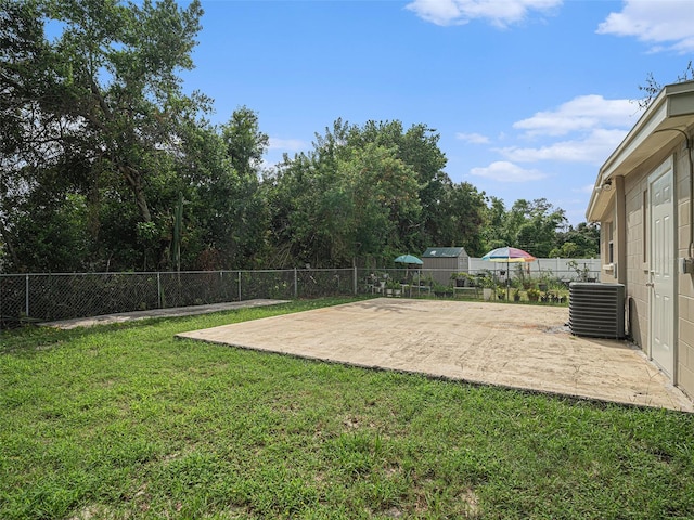 view of yard with a patio and central AC