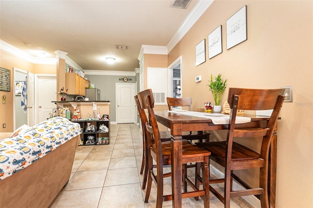 tiled dining space with crown molding