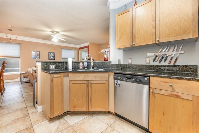 kitchen with ornamental molding, sink, kitchen peninsula, dishwasher, and dark stone countertops