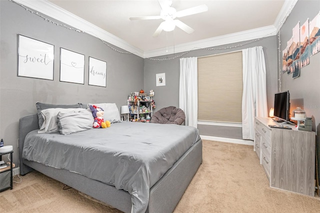 carpeted bedroom with ceiling fan and ornamental molding