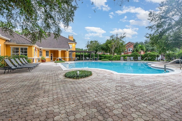 view of swimming pool featuring a patio