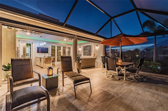 view of patio / terrace with glass enclosure and outdoor lounge area