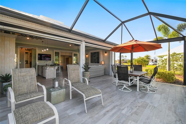 view of patio featuring a lanai and sink