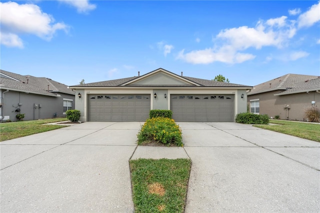 single story home with a garage