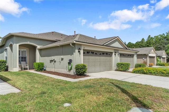 ranch-style house featuring a garage and a front yard