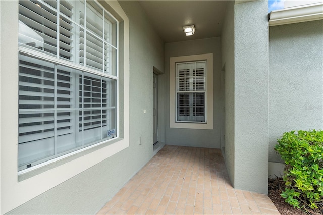 doorway to property with a patio area