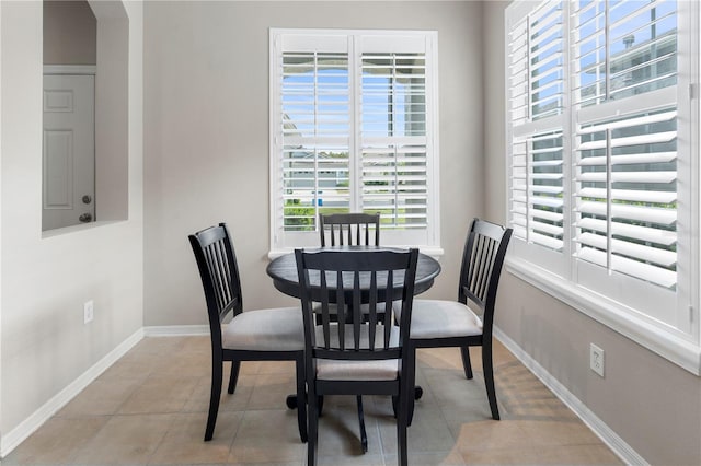 dining room featuring light tile patterned flooring