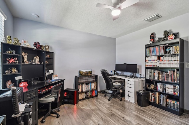 office featuring ceiling fan, a textured ceiling, and hardwood / wood-style floors