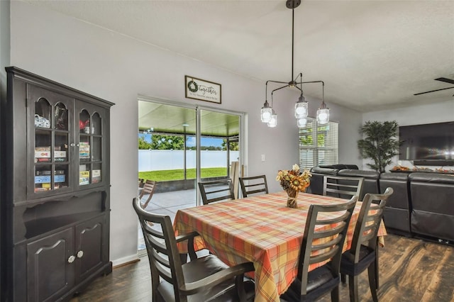 dining area featuring dark hardwood / wood-style floors and a notable chandelier