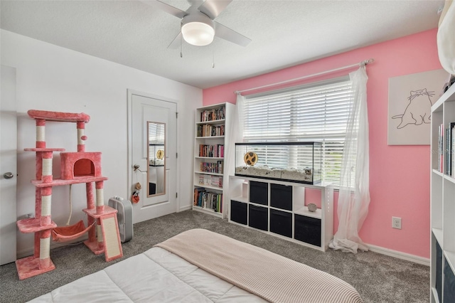 bedroom with carpet flooring, a ceiling fan, and baseboards