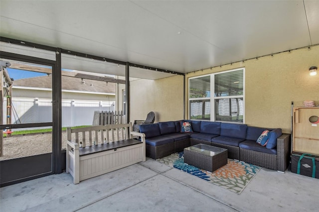 sunroom / solarium featuring an outdoor hangout area