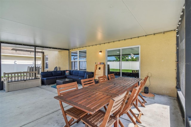 exterior space with an outdoor hangout area and fence