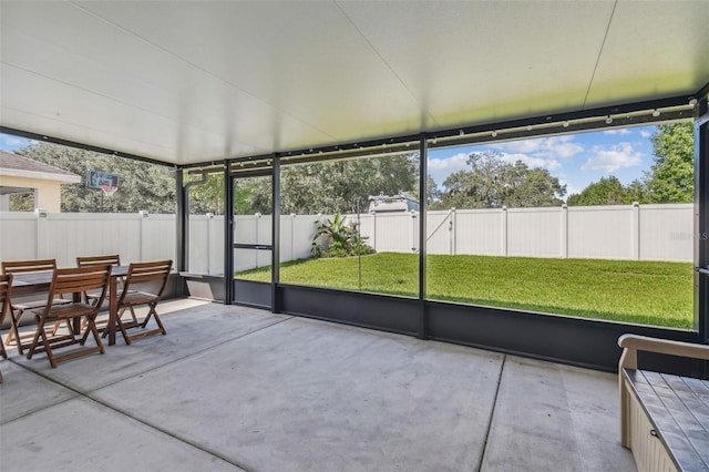 sunroom / solarium with outdoor dining area