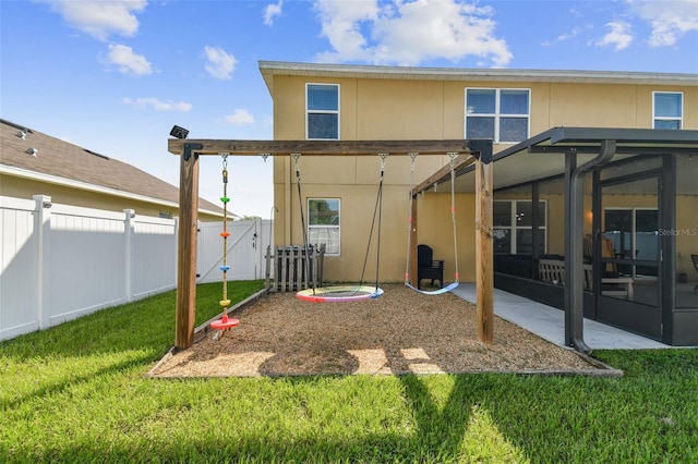 back of property featuring a yard and a patio area