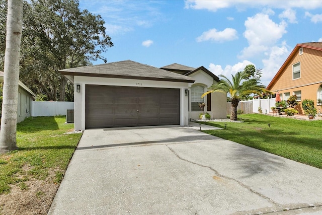 view of front of house featuring a garage, cooling unit, and a front lawn