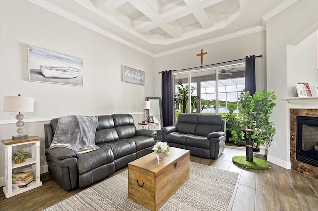 living room with beamed ceiling, ornamental molding, a premium fireplace, coffered ceiling, and hardwood / wood-style flooring