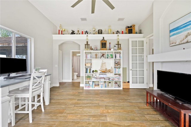 office space featuring wood-type flooring and ceiling fan