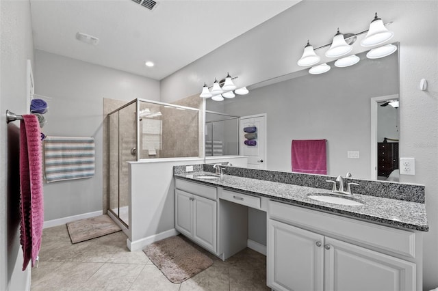 bathroom featuring vanity, ceiling fan, walk in shower, and tile patterned flooring