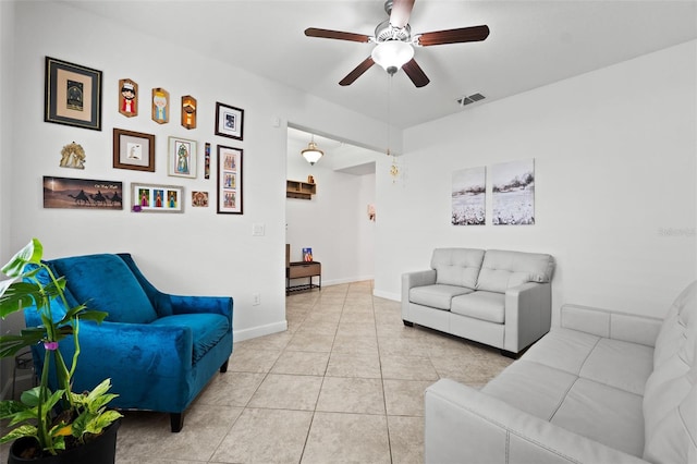 living room with light tile patterned floors and ceiling fan