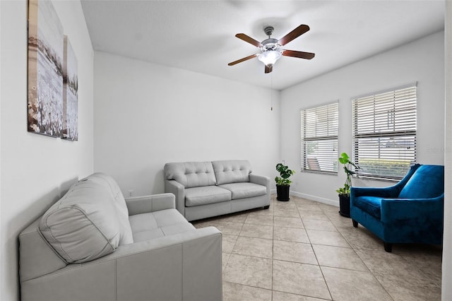 tiled living room with ceiling fan