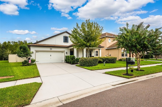 view of front of home featuring a front yard and a garage