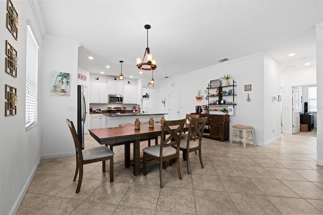 tiled dining room featuring crown molding and a notable chandelier