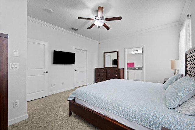 bedroom featuring ceiling fan, crown molding, ensuite bath, and light colored carpet