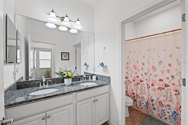 bathroom with vanity, a shower with shower curtain, toilet, and tile patterned floors