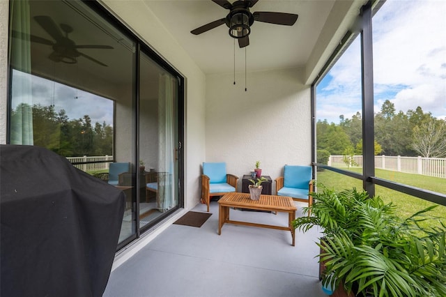 sunroom / solarium with ceiling fan